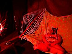 getting frisky in a tent fingering her wet hole in a hammock