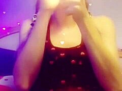 Seductive babe smokes cigarette while performing slow striptease, ripping clothes off provocatively