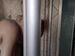 pale blonde and brunette wash each other in shower