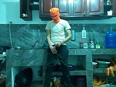 this 25-year-old guy with a big flaccid penis starts masturbating in the kitchen while waiting for his best friend to arrive