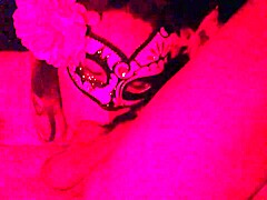 Masked in red light, this Latina gives a deep homemade blowjob on that cock