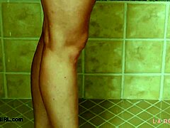 teen blonde model takes a relaxing shower after photoshoot