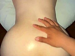 this oiled-up big ass latina gets ready for action. she's all smooth and shaved down there