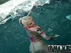 Tatted blonde Kitty Quinn gets oiled up for blonde blowjob and interracial fucking by big black cock poolside