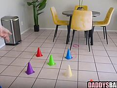 Girl scout stepdaughter casually tends to her stepdad's cock in a taboo family moment.