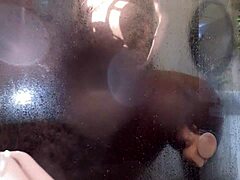 The hot ebony milf was trying her new toy in the shower when she got caught for a passionate interracial quickie.