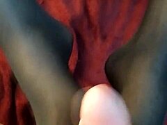 Intense footjob in stockings ends with cumshot