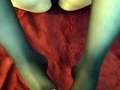 Intense footjob in stockings ends with cumshot