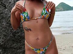 why is this super hot bikini girl dancing and flashing her cute petite ass on the tropical beach?