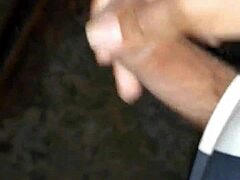 guy jerks off in public near train tracks, feeling the outdoor thrill.