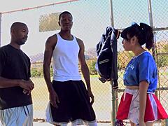 Asian Slut Sucks Two Black Cocks