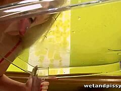 hey check her rubbing those big tits in the piss pool