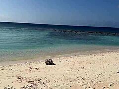 A shocked skinny babe in lingerie gets pissed on her oiled wet pussy at public beach pov