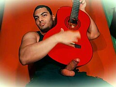 Sexy bodybuilder strokes 18cm monster cock guitar rub to explosive finish