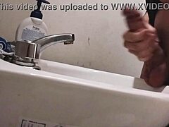 skinny dude rests huge balls on sink preps monster cock for massive cumshot