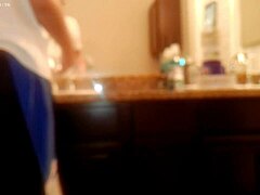 asian amateur tidies bathroom during house chores