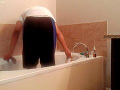 asian amateur tidies bathroom during house chores