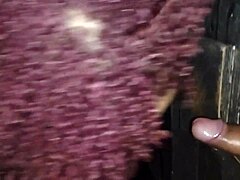 prostitute slut gives gloryhole blowjob to fan in swingers club