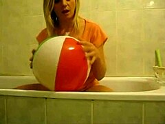 Sophie masturbates wildly with balloons in living room bathroom