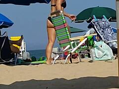 candid beach shots on this little slut in bikini